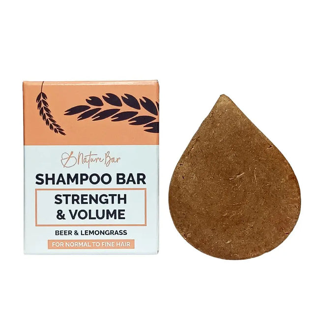 Shampoo Bar Kracht & Volume van Nature Bar naast de verpakking