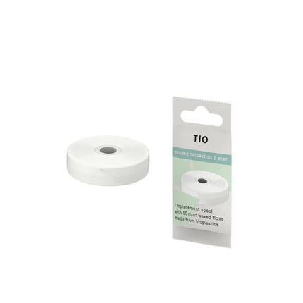 TIO flossrefill van bioplastic met witte spoel en verpakking met kokos-mint aanduiding